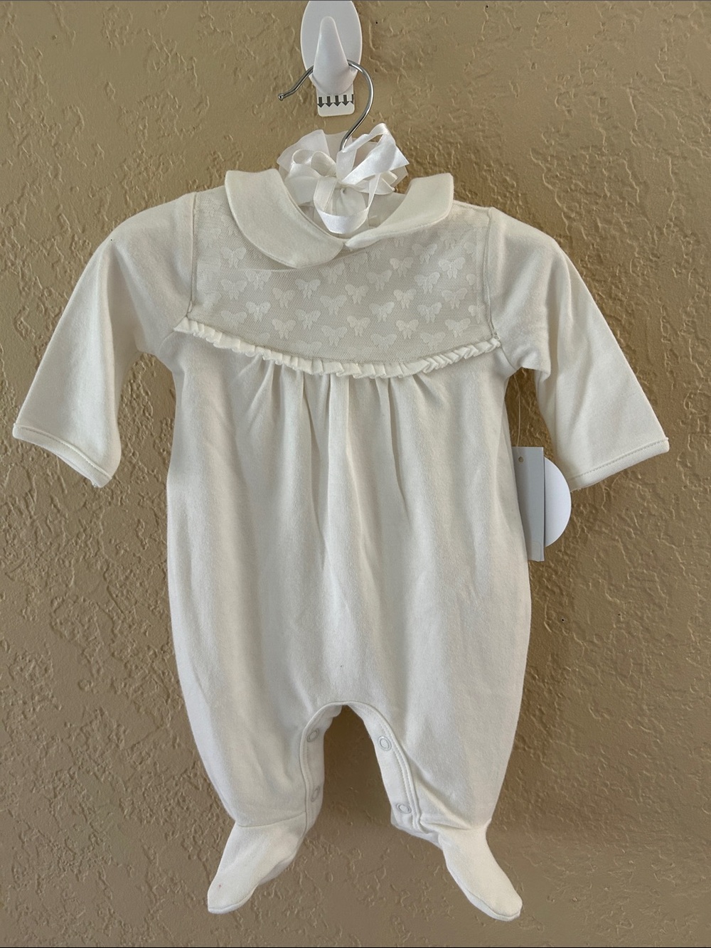 Edgehill Collection Ivory Footed Baby One-Piece with bow detail. NB
